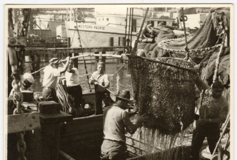 Men working on a fishing boat (ddr-densho-542-851)