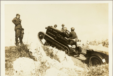 Italian officer supervising soldiers driving a small tank (ddr-njpa-13-810)