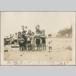 Children eating watermelon on the beach (ddr-densho-321-630)