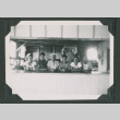 Six men sitting at a counter (ddr-densho-471-85)