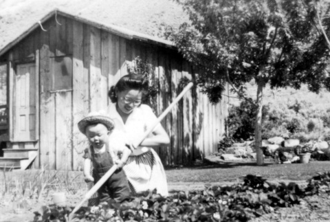 Woman and child in a garden (ddr-densho-2-27)