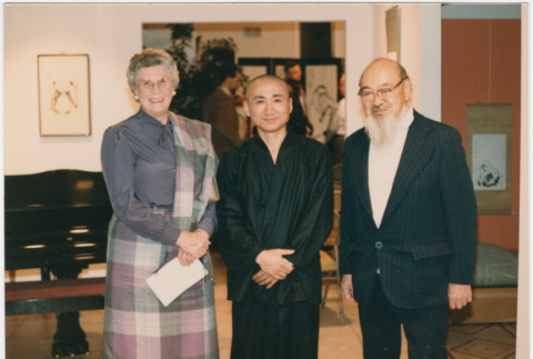 Kaneji Domoto with Priest Bon Jan and a woman at an art show (ddr-densho-377-318)