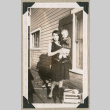 Woman holding baby on porch (ddr-densho-383-281)