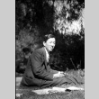 Man sitting on lawn (ddr-densho-426-2183)