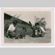 Two boys playing with toy trucks (ddr-densho-475-376)