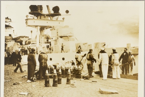 Argentinian sailors loading weapons and cargo onto a ship (ddr-njpa-13-456)
