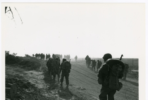 Naval air members walking on dirt road (ddr-densho-1007-139)