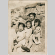 Four children sitting on rocks (ddr-densho-430-220)