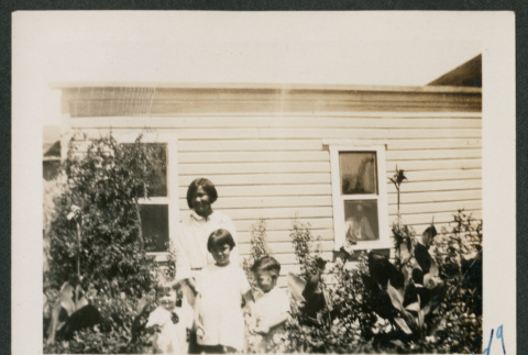 Four kids in garden (ddr-densho-378-625)