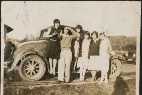 Group of five woman and a man standing by car (ddr-densho-316-191)