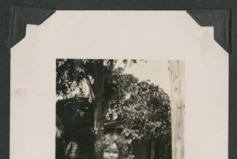 one girl in a yard (ddr-densho-378-509)