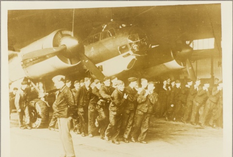 Men posing next to a Heinkel plane (ddr-njpa-13-839)