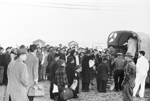 Japanese Americans loaded onto an army truck (ddr-densho-37-92)
