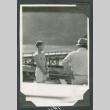 Toshiko Taniguchi sawing wood (ddr-densho-540-40)