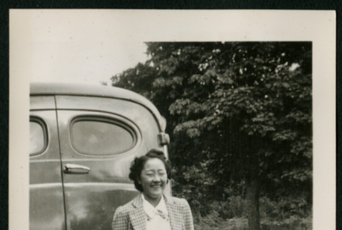 Woman in front of car (ddr-densho-359-387)