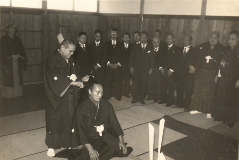 A sumo wrestler surrounded by others at a ceremony (ddr-njpa-4-2152)