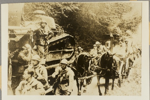 French soldiers driving a horse-drawn cart past a tank (ddr-njpa-13-1298)