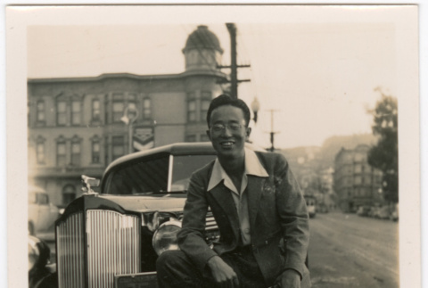 Man standing in front of car (ddr-densho-426-2108)
