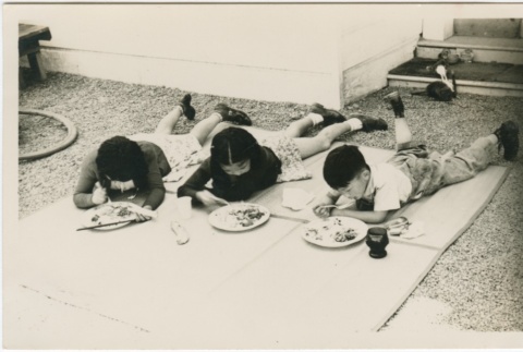 Three children having a picnic (ddr-densho-338-81)