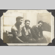 Three men sitting on a bed (ddr-densho-326-501)