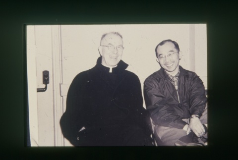 (Slide) - Image of priest and man seated (ddr-densho-330-178-master-3c969f35b7)