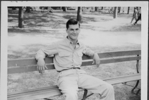 Man sitting on bench (ddr-densho-434-495)