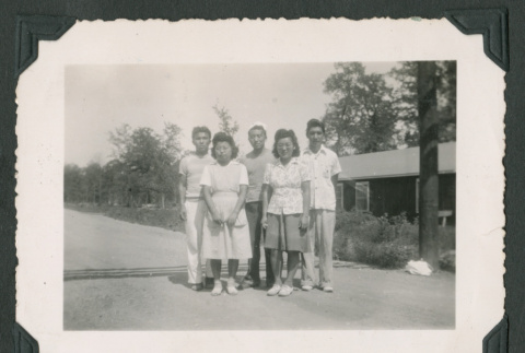 Five people pose outside (ddr-densho-471-78)