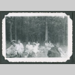 Group lounging in a forest (ddr-densho-471-40)