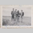 Four people standing on hill (ddr-densho-464-70)