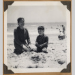 Woman and a boy at the beach (ddr-densho-542-90)