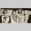 Duke Kahanamoku and other city officials posing with leis (ddr-njpa-2-492)