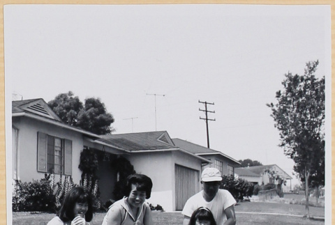 Family on lawn with dog (ddr-densho-522-112)