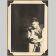 Man reading in a sunbeam (ddr-densho-542-147)
