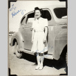 Woman standing next to car (ddr-densho-587-48)