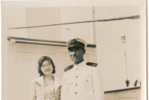 Tomoye (Nozawa) Takahashi with ship crew member on board ship (ddr-densho-426-1520)