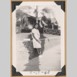 Girl on a sidewalk (ddr-densho-542-228)
