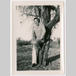 Man leaning on tree (ddr-densho-475-253)