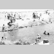 Japanese Americans swimming in the irrigation canal (ddr-densho-39-31)