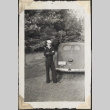 Man in sailors uniform standing by car (ddr-densho-466-903)