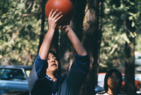 Glenn Osaki playing basketball (ddr-densho-336-831)