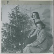 Guyo Tajiri and a friend next to a Christmas tree (ddr-densho-338-249)