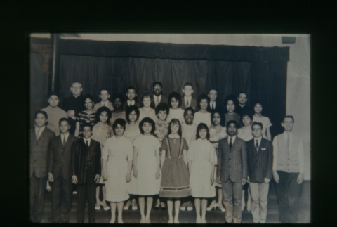 (Slide) - Image of group of young men and women with priest (ddr-densho-330-127-master-fe3d3d577e)