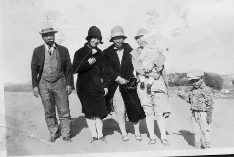 [Mr. and Mrs. Taniguchi with family at beach] (ddr-csujad-56-283)