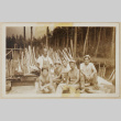 Six people surrounded by lumber (ddr-densho-433-718)