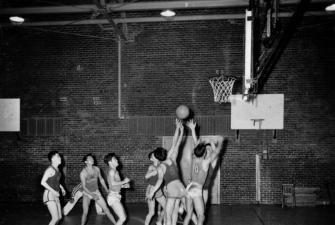 Men playing basketball (ddr-ajah-5-36)