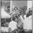 Japanese Americans waiting with baggage (ddr-densho-151-120)