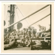 Soldiers sitting on deck of ship (ddr-densho-368-31)