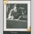 Man sitting on cot, writing (ddr-densho-434-65)