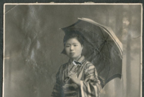Woman in kimono and umbrella (ddr-densho-316-181)