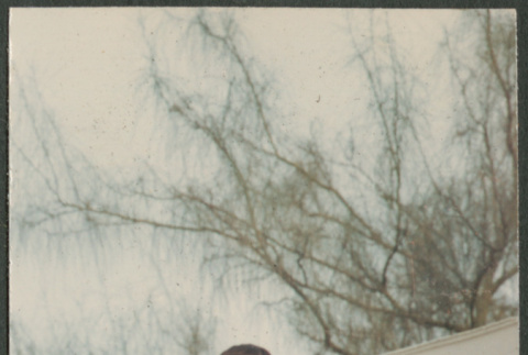 Woman and baby standing on wall (ddr-densho-523-408)